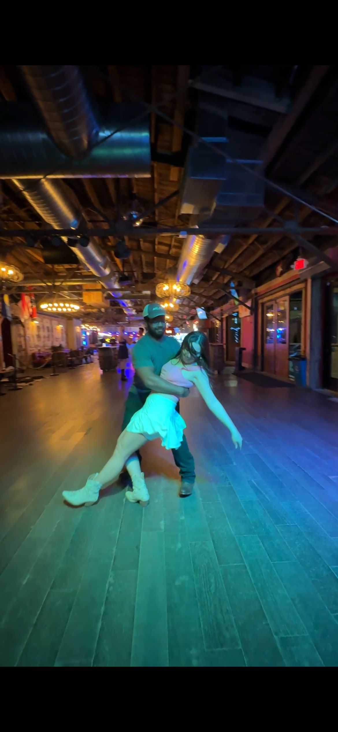 C.J. and his partner country swing dancing in the photo that inspired the Hardwood Duke Dancing logo